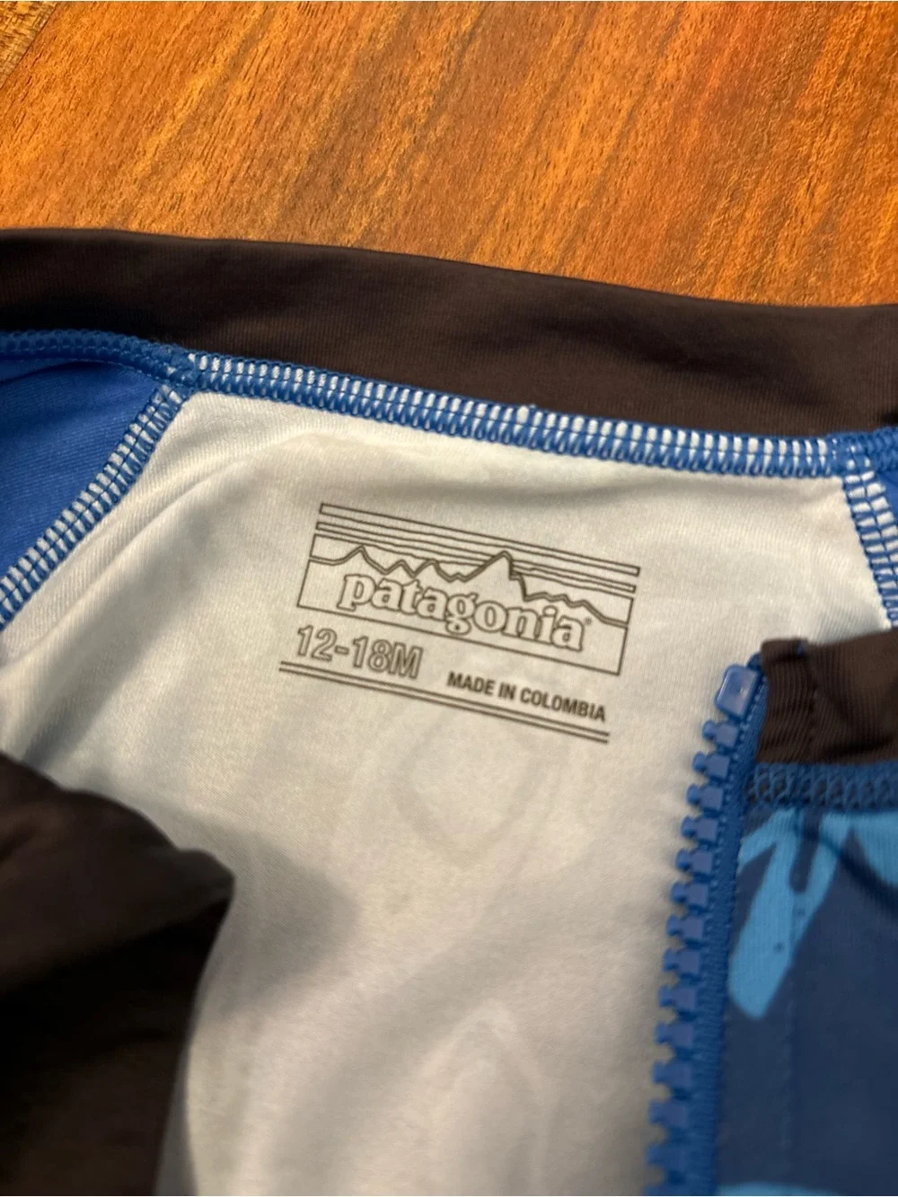 Patagonia blue/black long sleeve rashguard bathing suit with front zipper